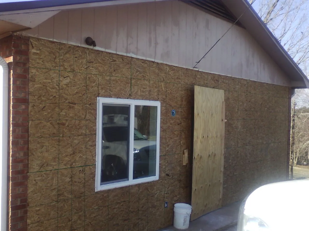 OSB sheathing on a garage addition wall before siding in Mount Rainier